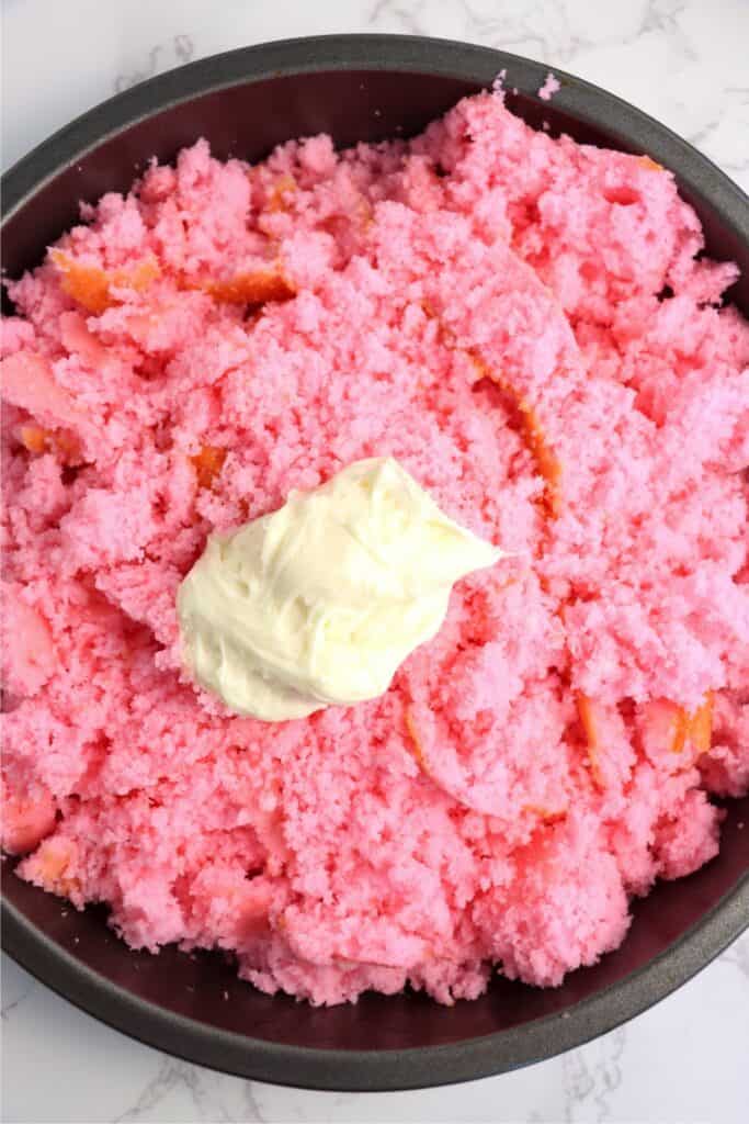 Overhead shot of crumbled cake with fosting on top