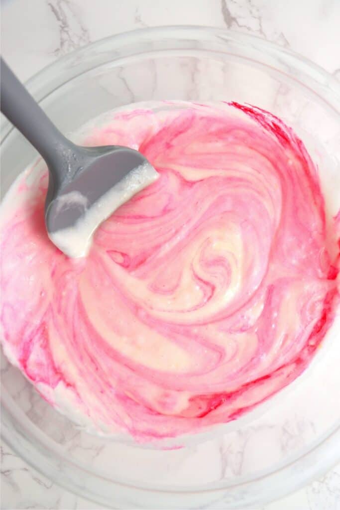 Overhead shot of pink cake batter in mixing bowl
