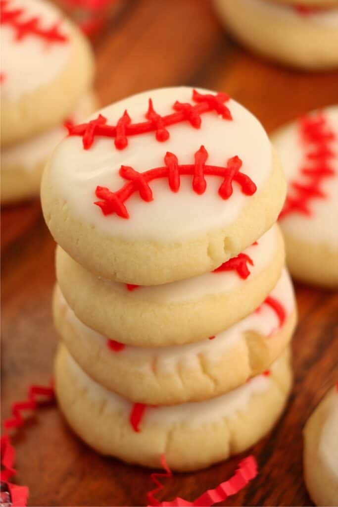 Closeup shot of baseball sugar cookies stacked atop one another.