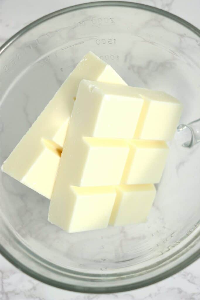 Closeup overhead shot of almond bark in glass bowl.