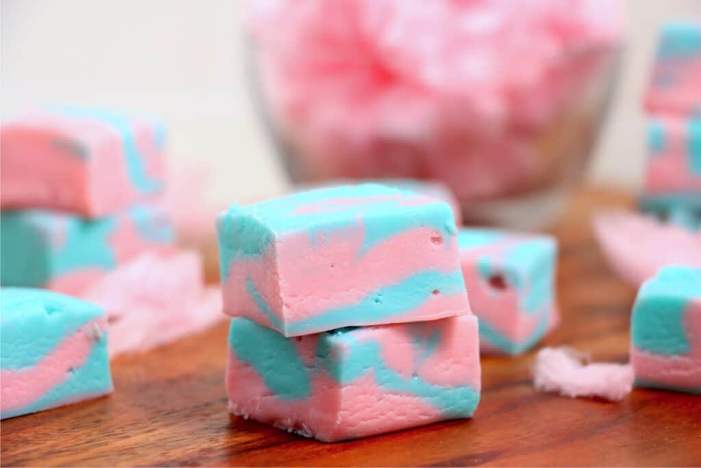 Closeup shot of two cotton candy fudge squares stacked atop one another. 