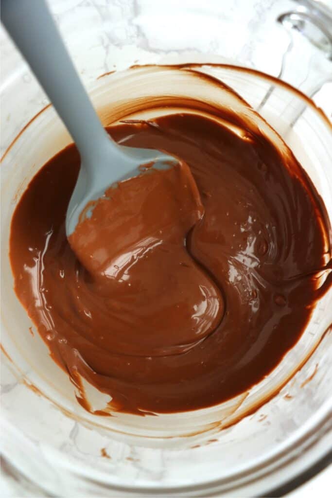Overhead shot of melted chocolate in glass bowl