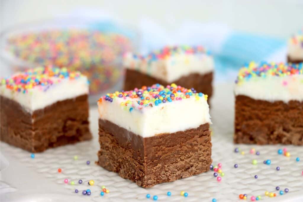 Clopseup shot of frosted fudge squres on plate