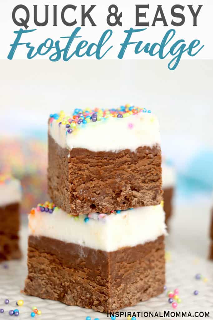 Two frosted fudge squares stacked atop one another. 