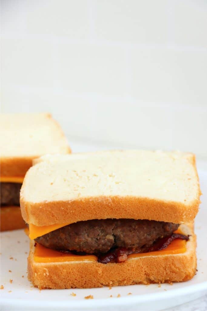 Closeup shot of grilled cheese bacon hamburger on plate