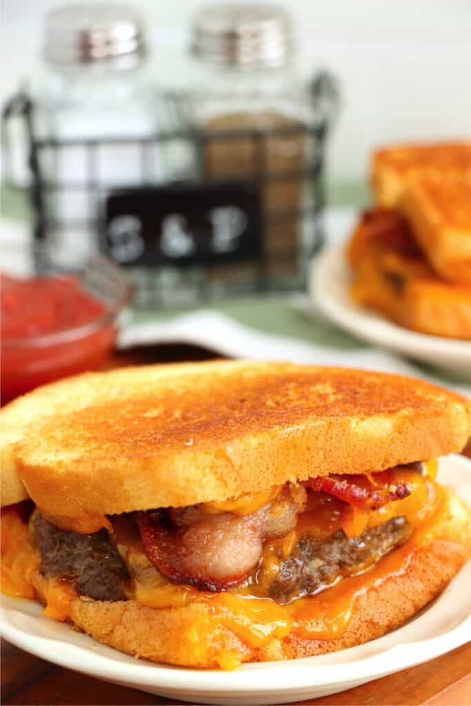 Closeup shot of grilled cheese bacon hamburger on plate