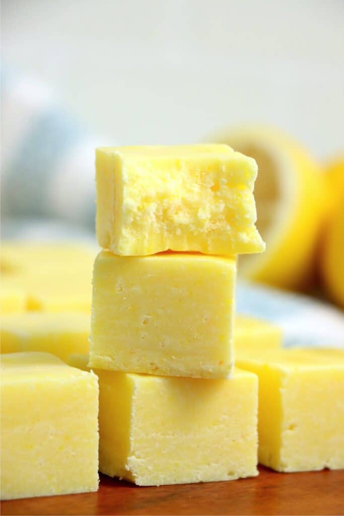 Closeup shot of fudge squares stacked atop one another.