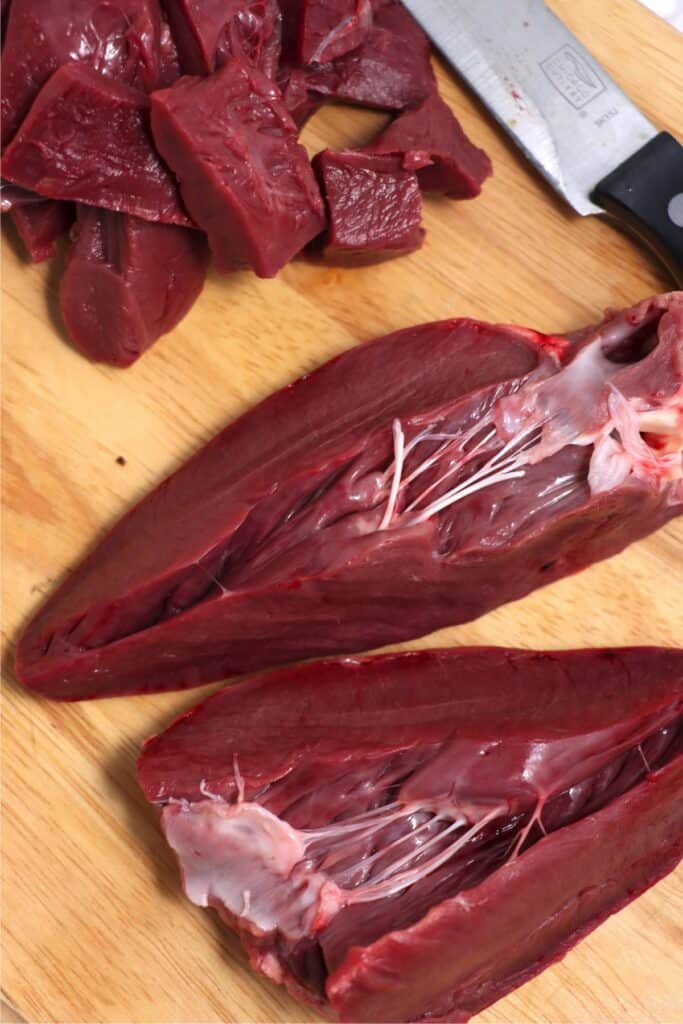 Overhead shot of venison heart cut in half.