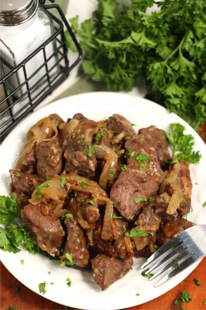 Overhead shot of venison heart and onions on plate