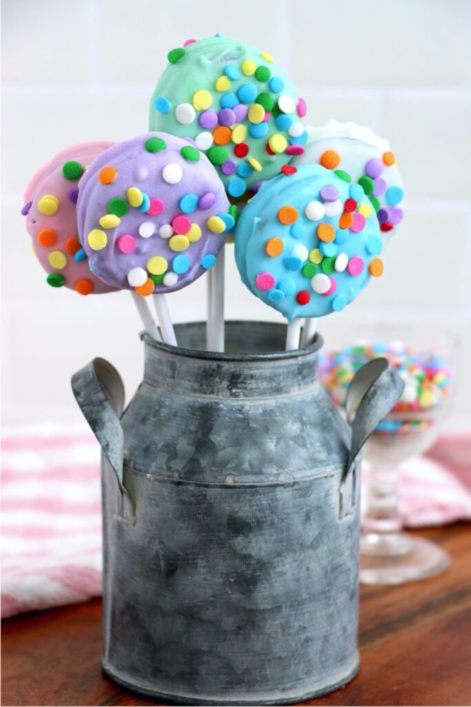 Closeup shot of chocolate covered Easter Oreos in metal bucket
