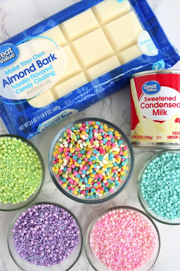 Overhead shot of individual Easter fudge ingredients in bowls on table