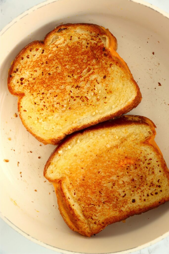 Overhead shot of garlic grilled cheese in pan