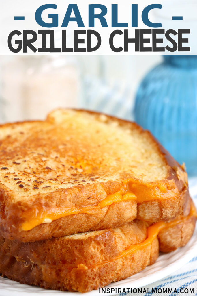 Closeup shot of two garlic grilled cheese sandwiches on plate