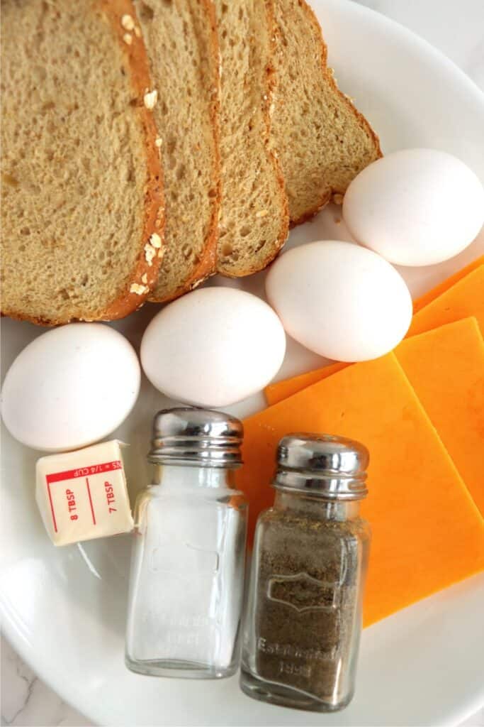 Closeup overhead shot of individual grilled cheese ingredients on plate