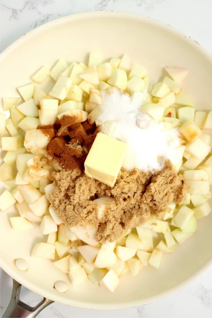 Overhead shot of apple pie filling ingredients in skillet