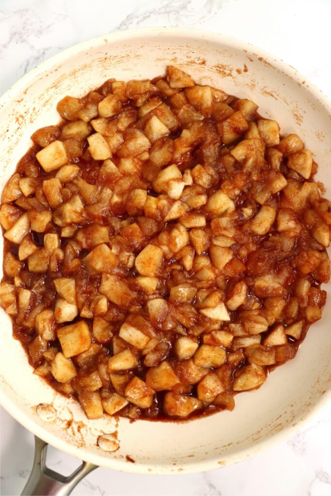 Overhead shot of cooked apple filling in skillet. 