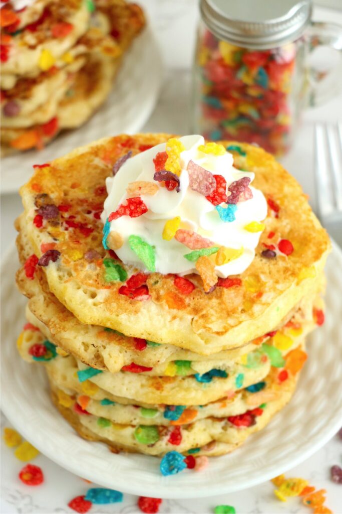 Closeup shot of Fruity Pebbles pancakes on plate.