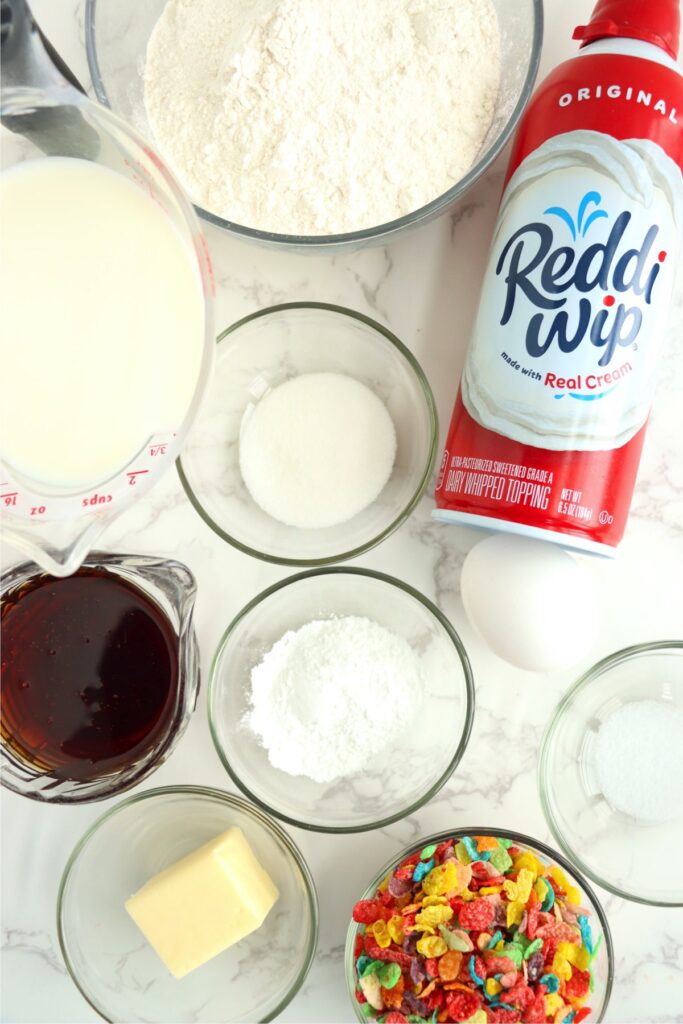 Overhead shot of individual Fruity Pebbles pancakes ingredients on table