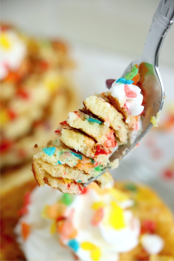 Closeup shot of forkful of Fruity Pebbles pancakes