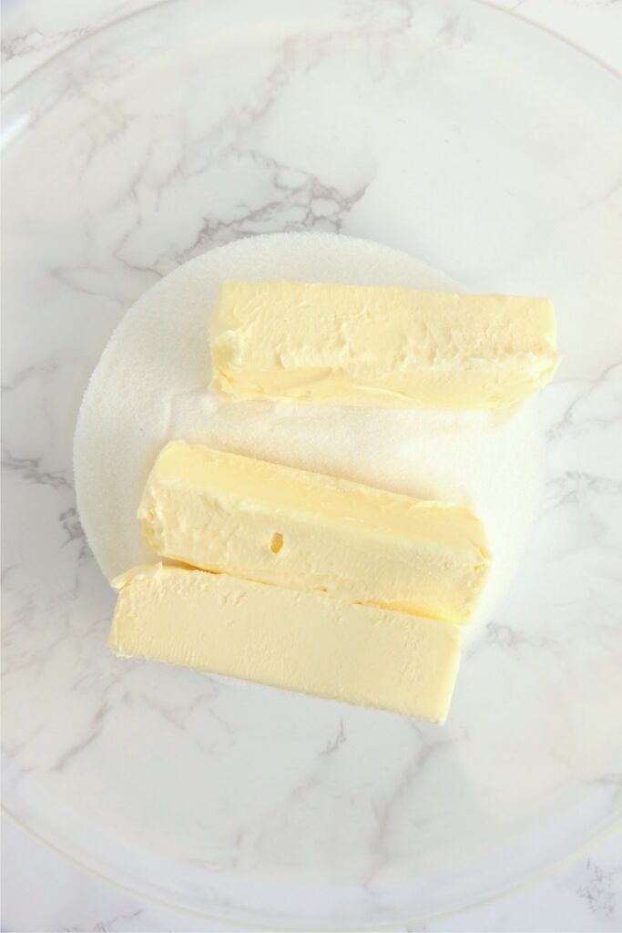 Overhead shot of butter and sugar in mixing bowl