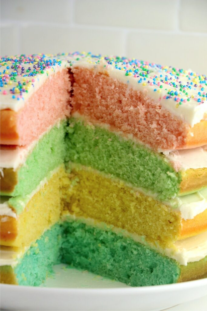 Closeup shot of pastel layer cake with slice removed