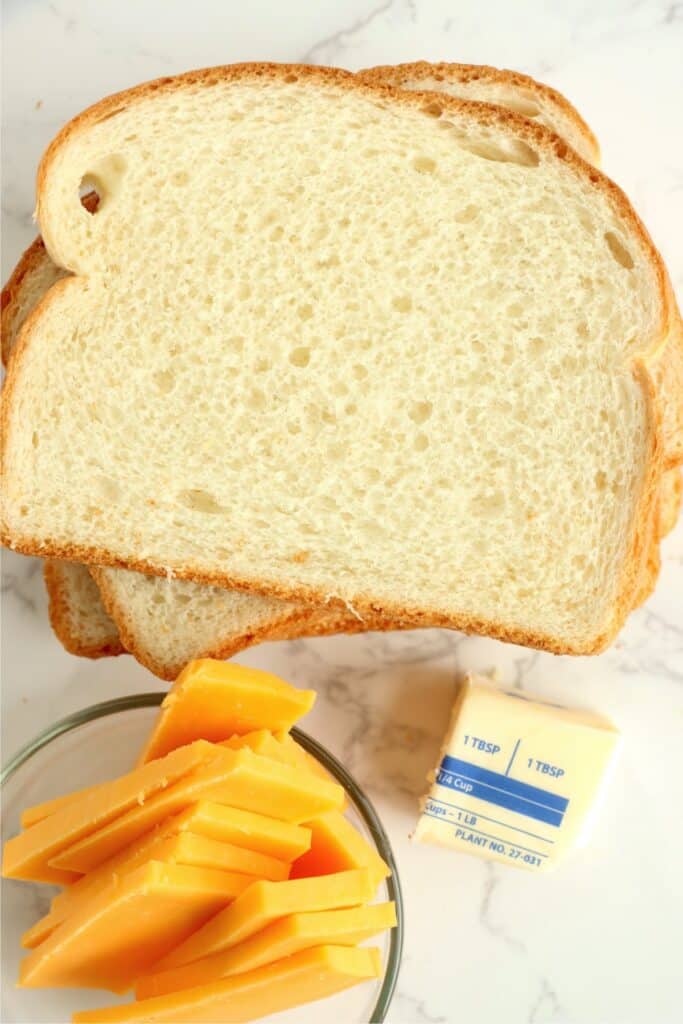 Closeup shot of grilled cheese sandwich ingredients on table