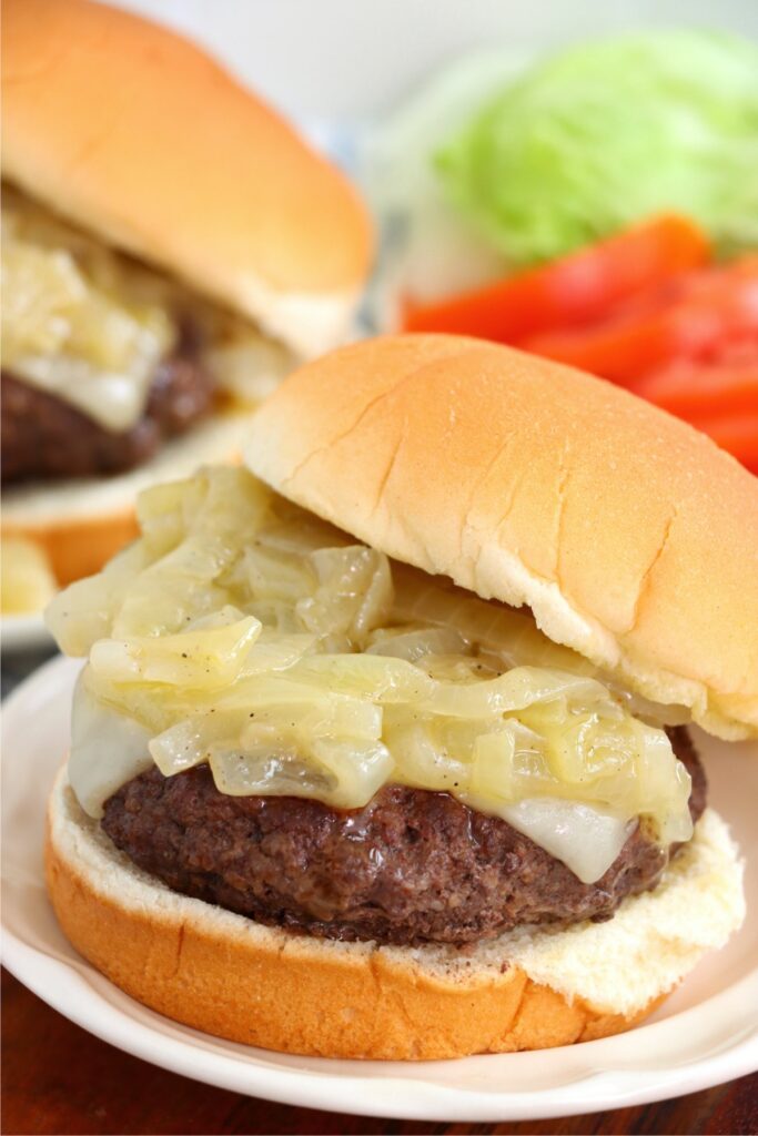 Closeup shot of grilled onion cheddar burger.