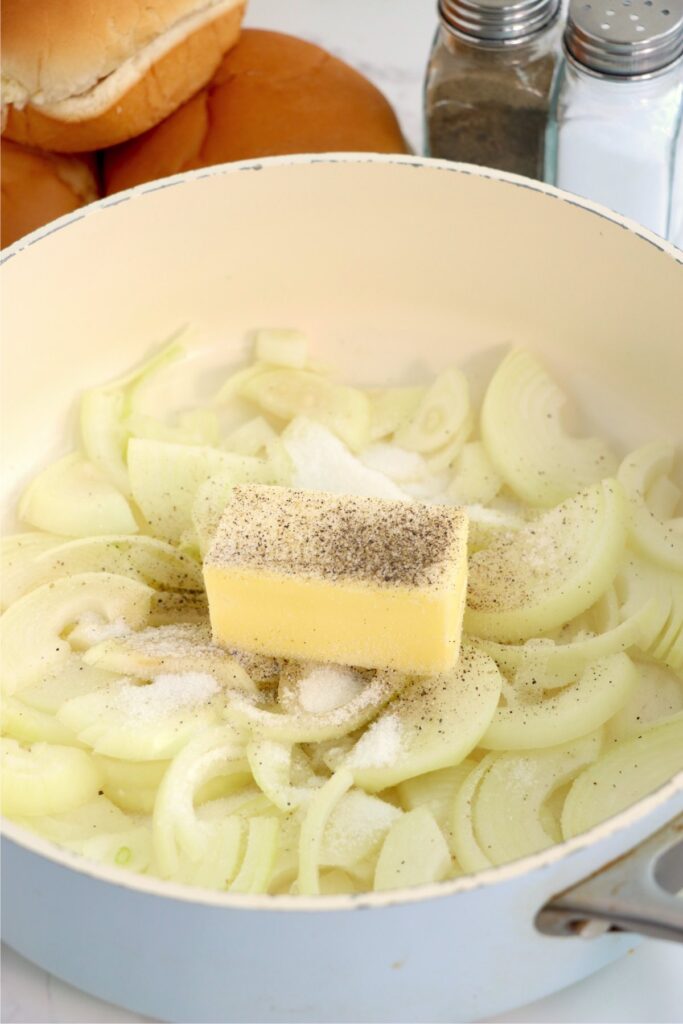 Closeup shot of onions and butter in skillet