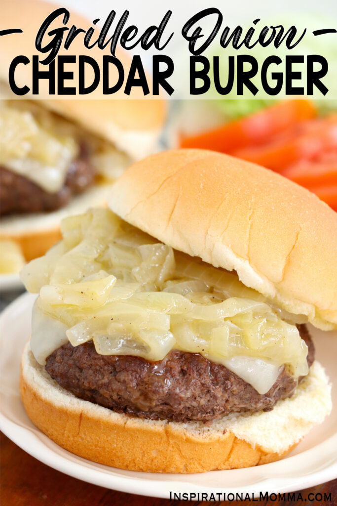 Closeup shot of grilled onion cheddar burger on plate