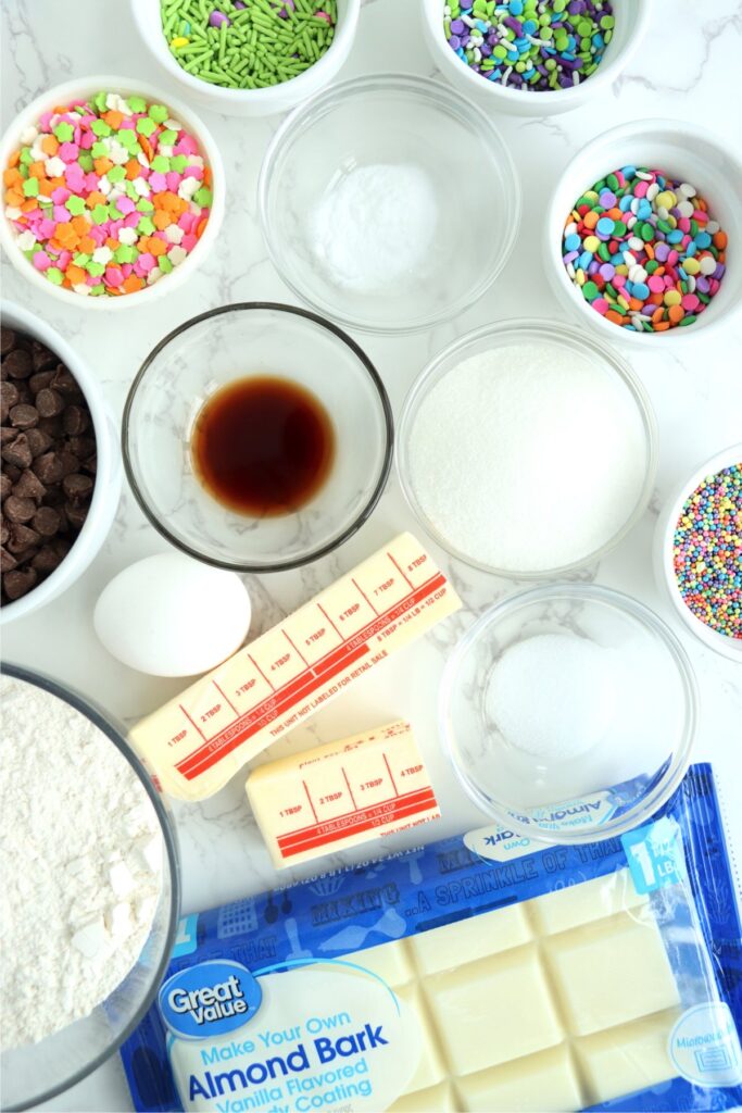 Overhead shot of individual chocolate chip Easter cookie ingredients on table