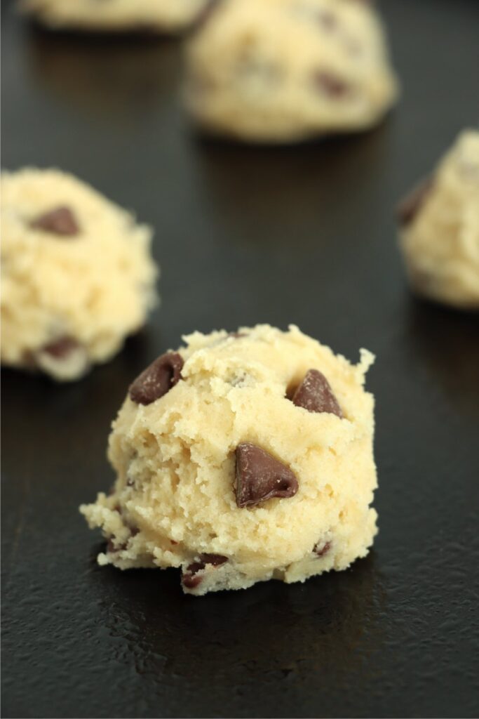 Closeup shot of chocolate chip Easter cookie dough balls on cookie sheet