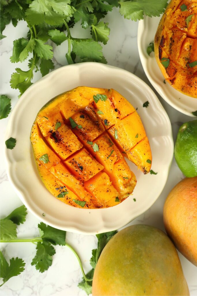 Overhead shot of grilled mangoes on plates