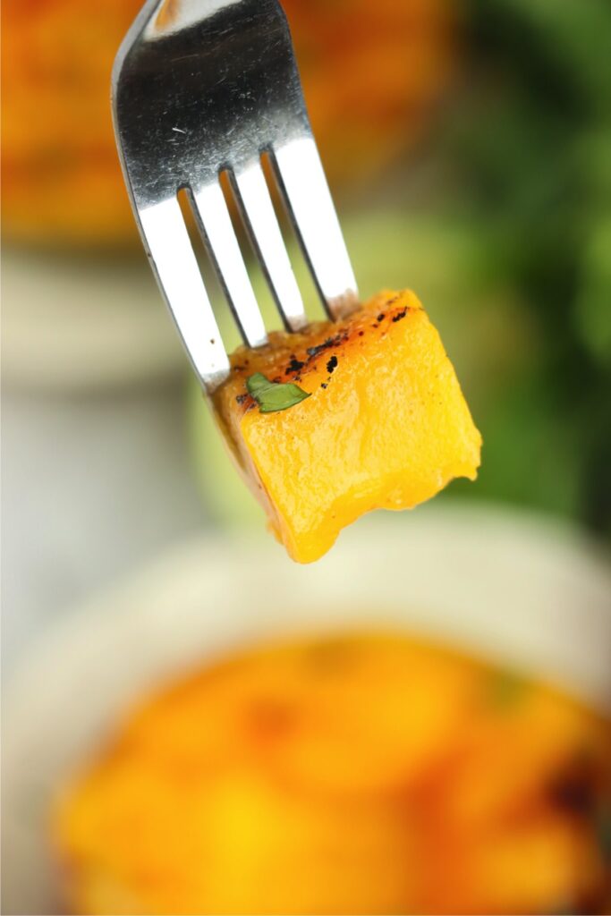 Closeup shot of forkful of grilled mango