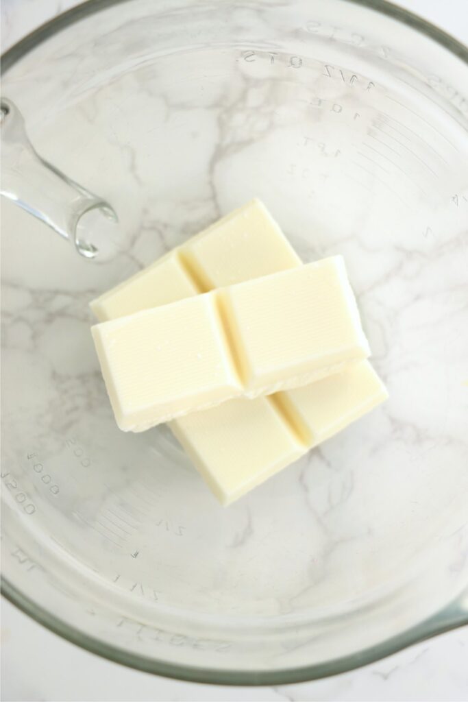 Overhead shot of vanilla bark squares in glass bowl