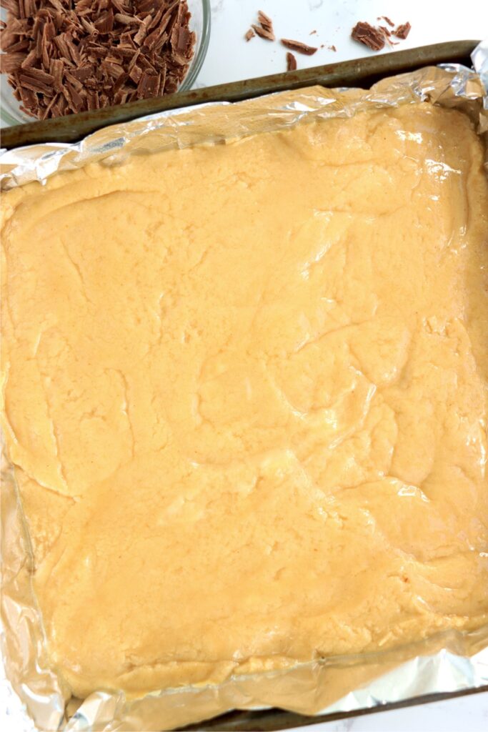 Overhead shot of no bake peanut butter fudge mixture in prepared pan