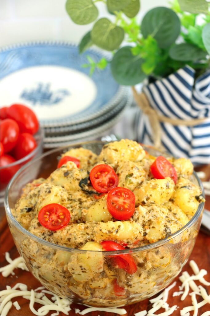 Bowlful of pest gnocchi on table.