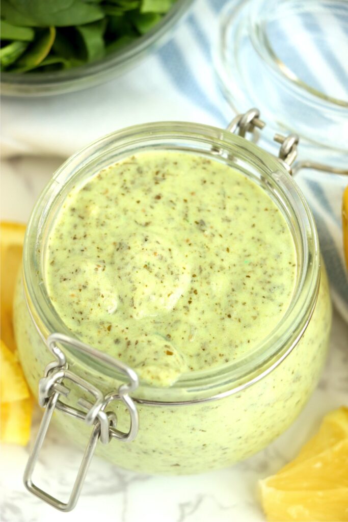 Closeup overhead shot of pesto mayo recipe in glass jar