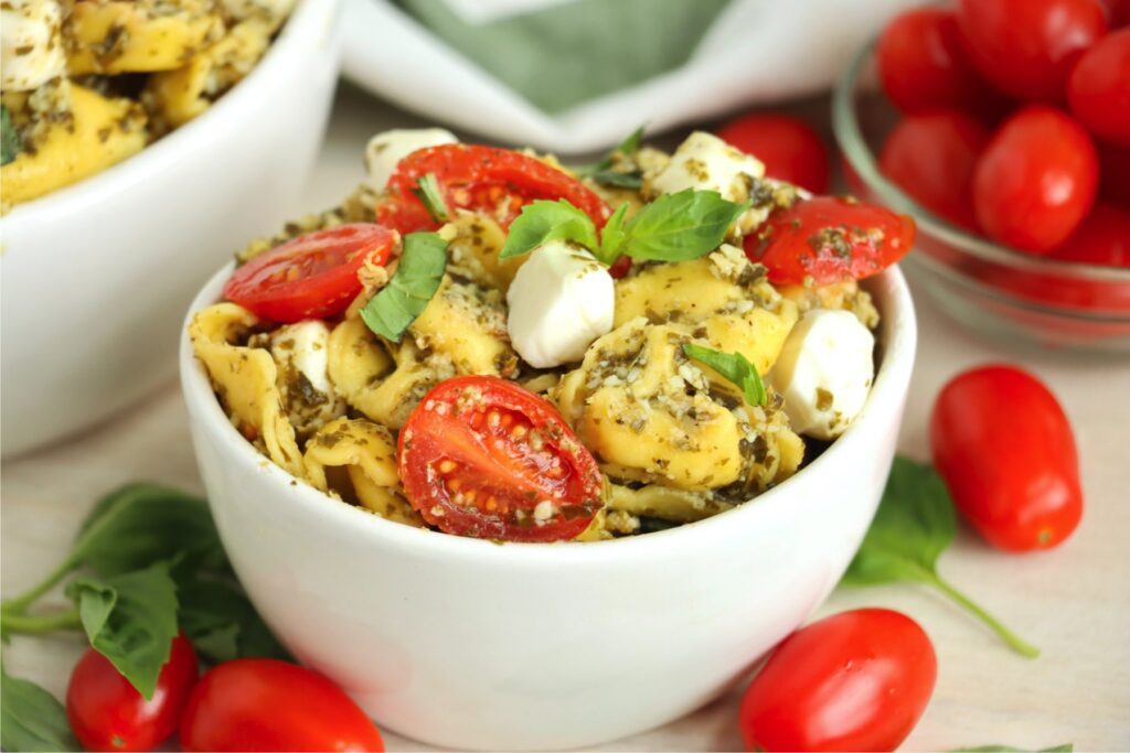 Closeup shot of bowlful of pesto tortellini salad