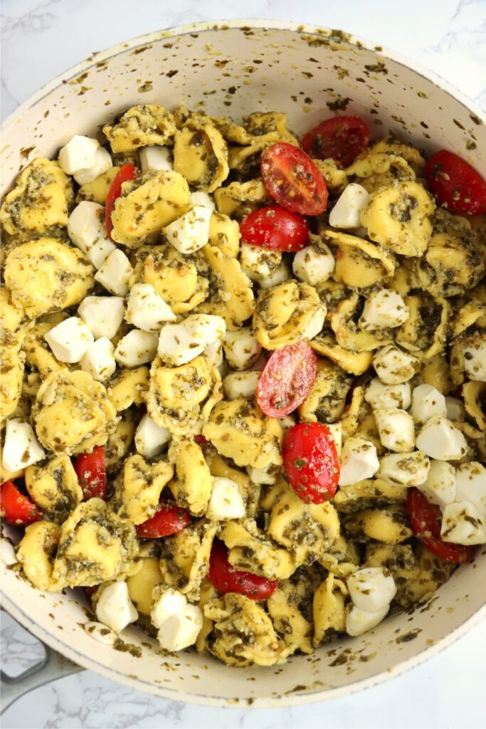 Overhead shot of pesto tortellini salad in pot