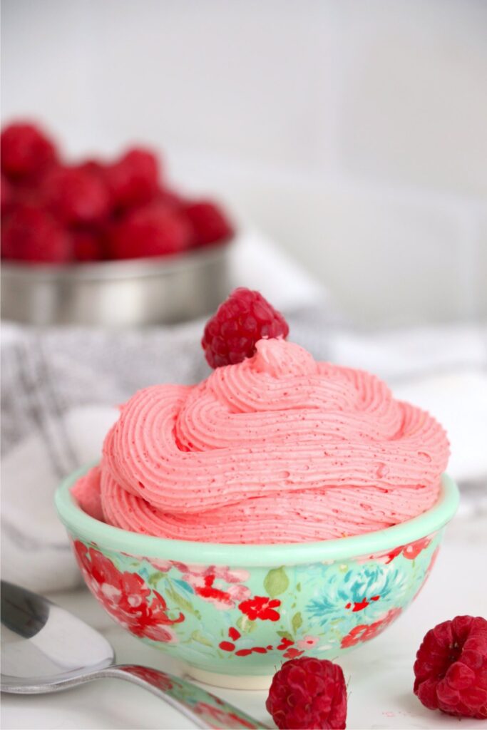 Closeup shot of bowlful of raspberry Cool Whip dessert in bowl