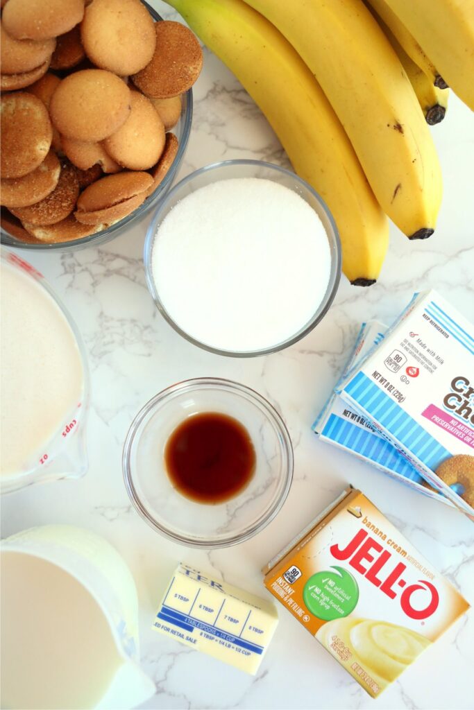 Overhead shot of individual banana pudding lasagna ingredients on table