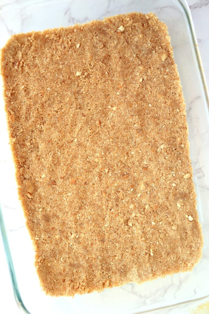 Overhead shot of vanilla wafer crust in baking dish