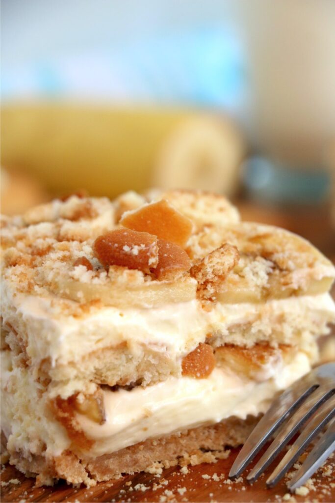 Closeup shot of slice of banana pudding lasagna with fork