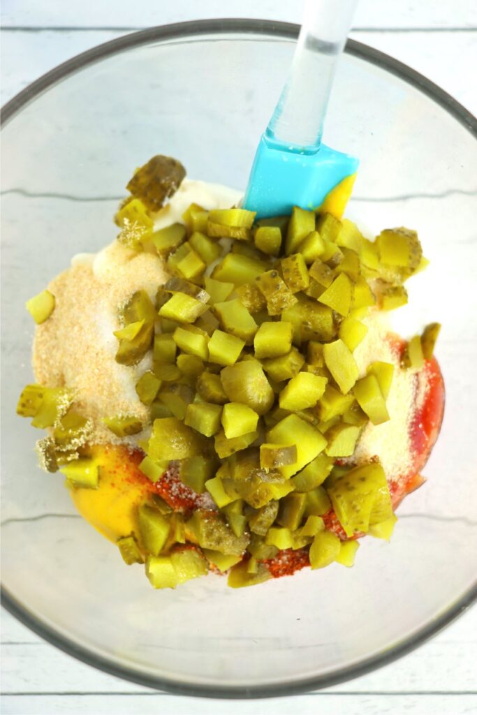 Closeup overhead shot of Big Mac sauce ingredients in mixing bowl with spatula