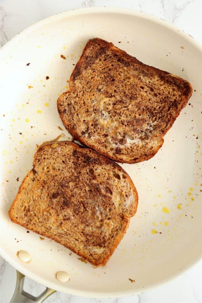 Overhead shot of uncooked chocolate French toast in skillet