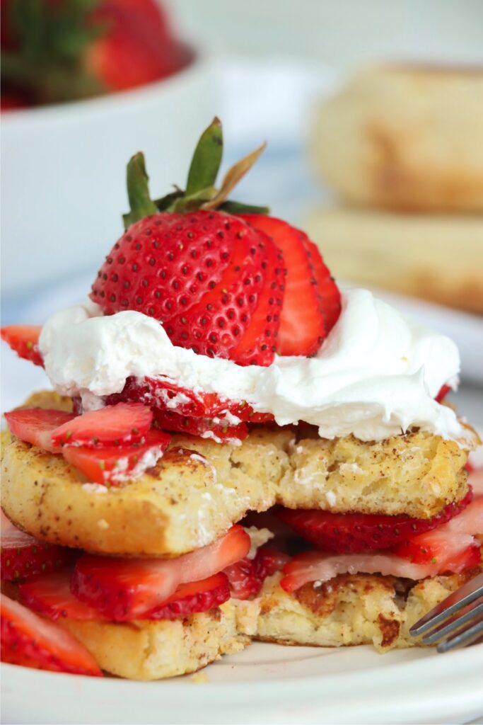  Closeup shot of English muffin French toast with slice removed on plate