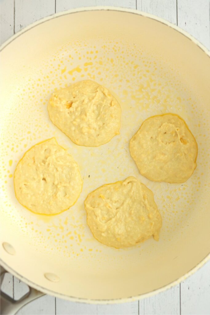 Overhead shot of mango pancake batter in skillet