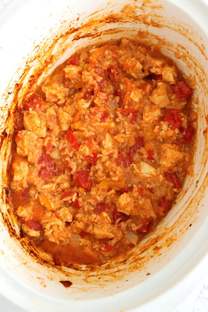 Overhead shot of cooked slow cooker taco chicken and rice in slow cooker