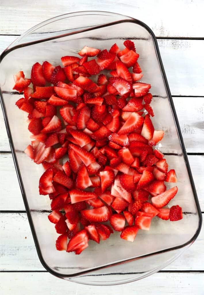 Overhead shot of sliced strawberries in baking dish