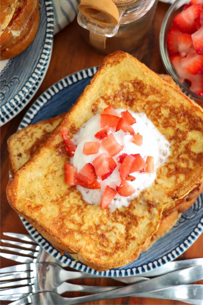 Overhead shot of sweet Hawaiian bread French toast on plate.